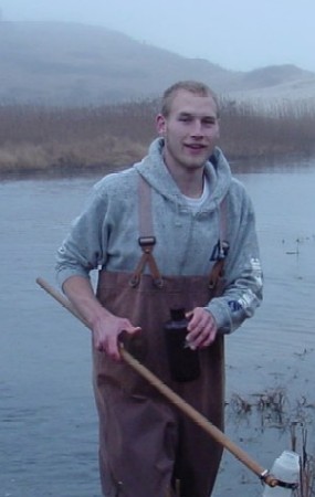 Intern gets hands-on experience conducting water sampling in a Seashore pond