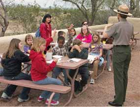 Park Ranger Denise Shultz conducts an outdoor classroom activity.