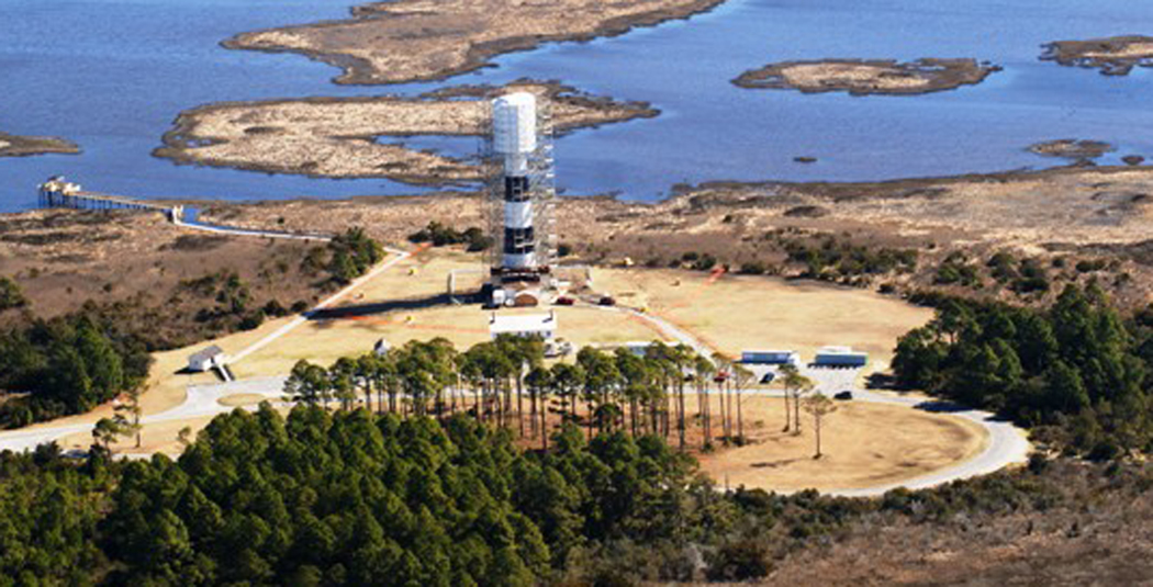 An aerial photograph of the Bodie Island Lighthouse undergoing renovations.