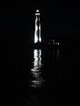 Lighthouse reflected in water