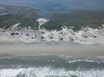 Long Point cabins, dunes eroded, sand filled docks and under cabins