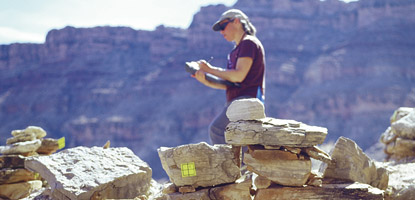 photo: Mapping a site on the Colorado River. The yellow tags serve as reference points for architectural drawings.