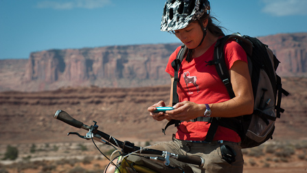 Keeping in touch: a mountain biker sends a few texts near Airport Tower on the White Rim Road.