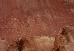 This petroglyph panel depicts anthropomorphic figures with trapezoidal bodies. Petroglyphs may have been used by prehistoric cultures to depict religious ceremonies, hunting trips, travel routes, and much more.