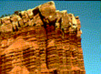 Part of the Moenkopi Formation with Shinarump sandstone visible just below a layer of Chinle