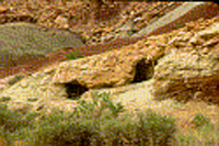 Holes in the side of this hill are left overs from the uranium mines.