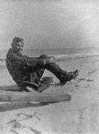 Sandburg sitting on the beach
