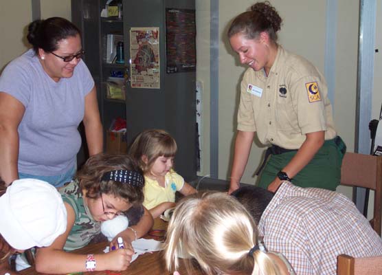 SCA Amy Johnson (left) helping out in the Kids Corner at Carlsbad Caverns National Park.