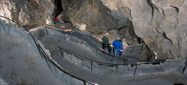 Visitors walking down the switchbacks on the Natural Entrance trail