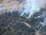 Burning continues south along volcano road.