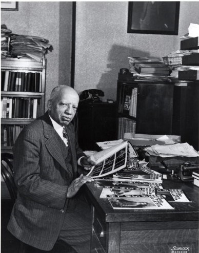 Dr. Carter G. Woodson sits at his desk in his office located at his home, 1538 Ninth Street, N.W.
Scurlock Studio Records
Archives Center
NMAH, Smithsonian Institution