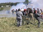 Confederate artillery soldiers fire their cannon