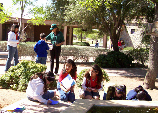 Students learning in the park's Spanish Garden.