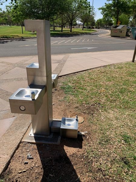 outdoor metal water fountain with two levels of drinking fountain, one bottle filler, and a dog watering fountain