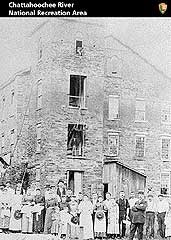 Black and white photograph of female workers outside the Ivy Mill.
