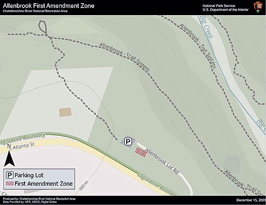 First Amendment Zone is the grassy area on the left side of the access road just before the the parking lot.