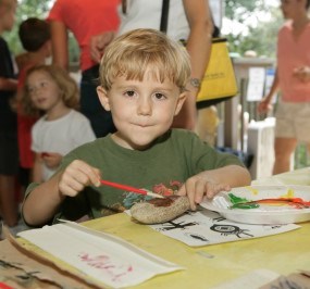 Child painting rock at the Chattahoochee River NRA Summer Festival.