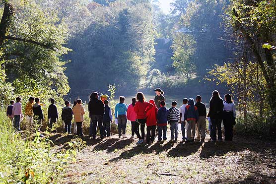 Students from Hamilto Homes ES learn about the Chattahoochee River from Ranger Marjorie Thomas while on a Ticket-to-Ride field trip.