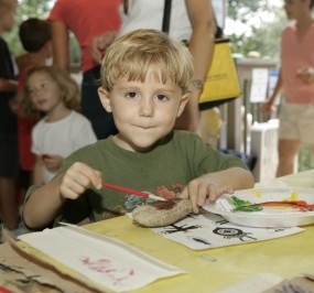 Child painting rock at the Chattahoochee River NRA Summer Festival.