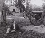 Unidentified man in front of Snodgrass Cabin