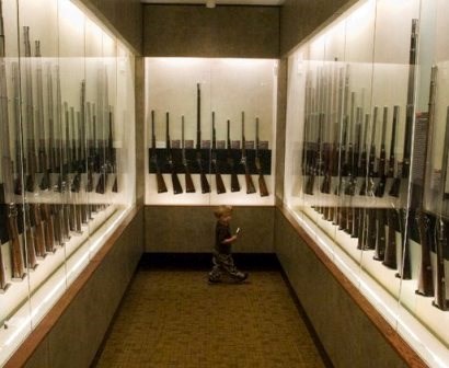 A young visitor explores the Fuller Gun Collection