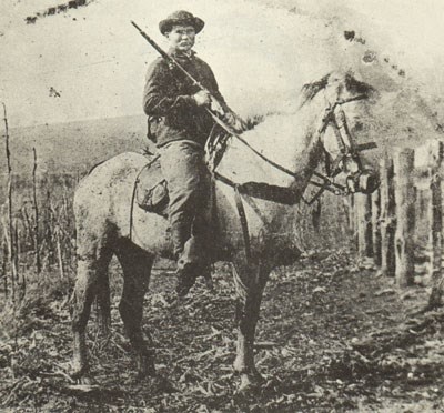 John Munson of the 72nd Indiana Infantry sits on his horse while carrying a Spencer Rifle