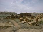 Photo of Pueblo Bonito and Threatening Rock