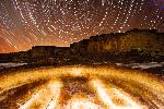 Pueblo Bonito Kiva at night with star paths