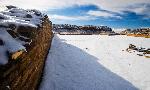 Photo of the north wall in Pueblo Bonito with snow