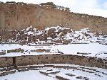 Photo of great kiva in Pueblo Bonito in snow