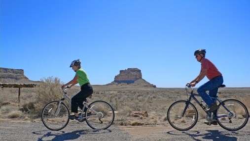 Bicyclists in front of Fajada Butte