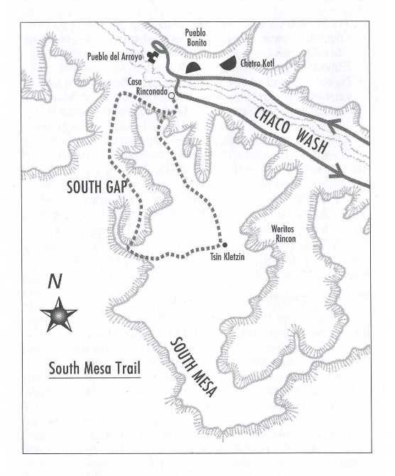 A black and white map of a dashed loop trail called South Mesa Trail. Solid lines indicate the road, with dark black archeological sites identified on the map. Several features are identified within the map.
