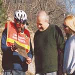 Photo of bike patroller assisting visitors.