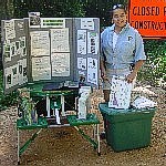 Photo of volunteer with display.