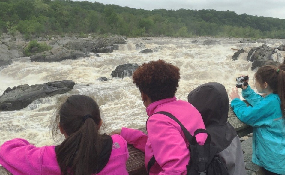 Students watching Great Falls from the overlook