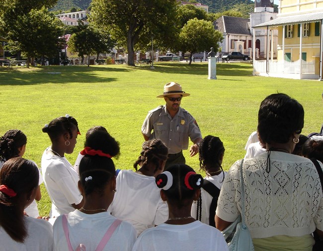 NPS ranger giving a tour to summer camp youth