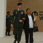 A soldier with the U.S. Army's 101st Airborne Division escorts Little Rock Nine member Elizabeth Eckford to the dedication ceremony, September 24, 2007.