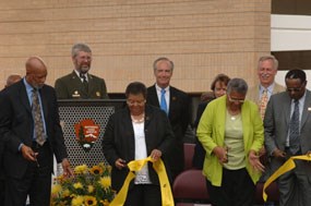 Several of the Little Rock Nine cut the ribbon to officially dedication the park's new visitor center.