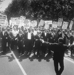 1963 March on Washington. Civil Rights leaders begin the march with fellow marchers holding signs urging an end to segregation and increased job opportunities.