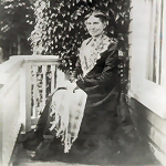Clara Barton seated on the front porch of her Glen Echo home in 1910.