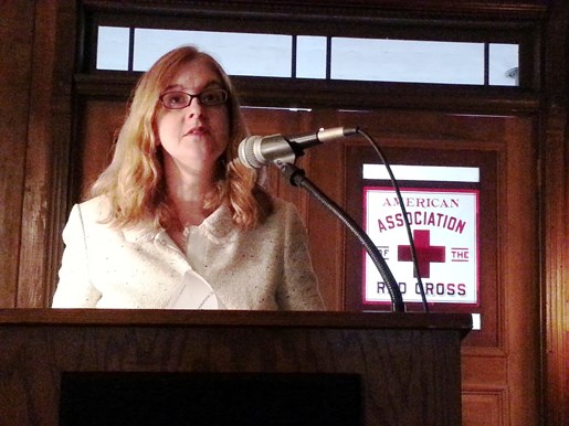 Marian Moser Jones speaks from a podium at Clara Barton National Historic Site.