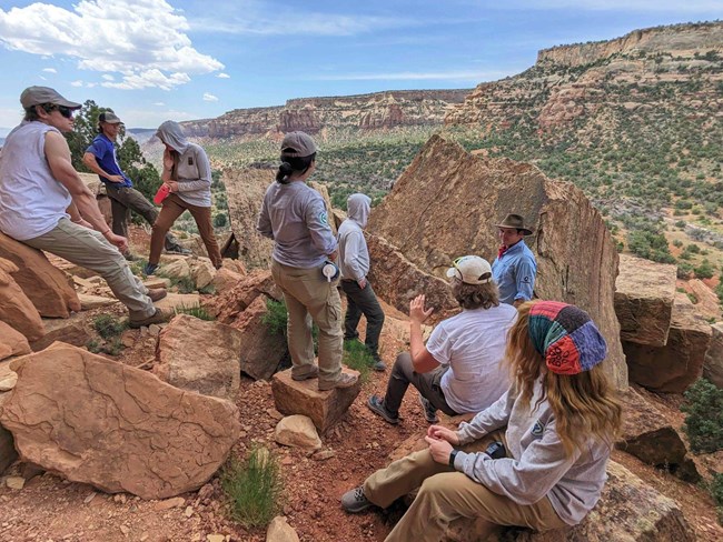 A group of teens and rangers gathered in the Colorado National Monument