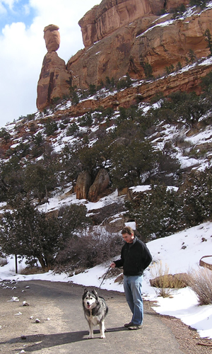 A visitor and dog at Balanced Rock Overlook.