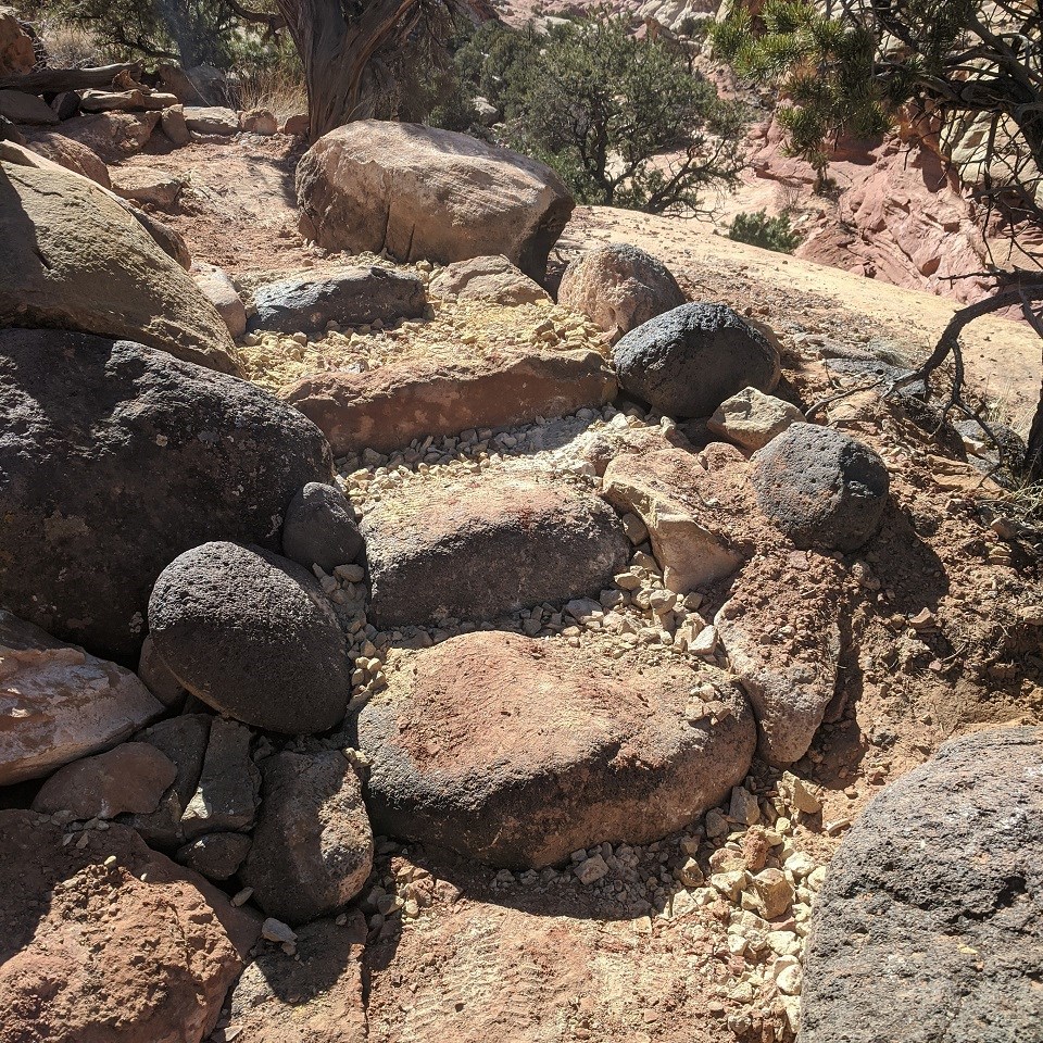 rocks and boulders of various sizes obscure the trail