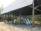 a whale skeleton under a covered shelter