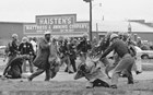 Police beating protesters. 