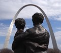 Statue of Dred and Harriet Scott looking towards the Gateway Arch.