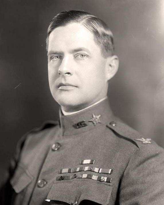 black and white photo of a man in a high collared military uniform