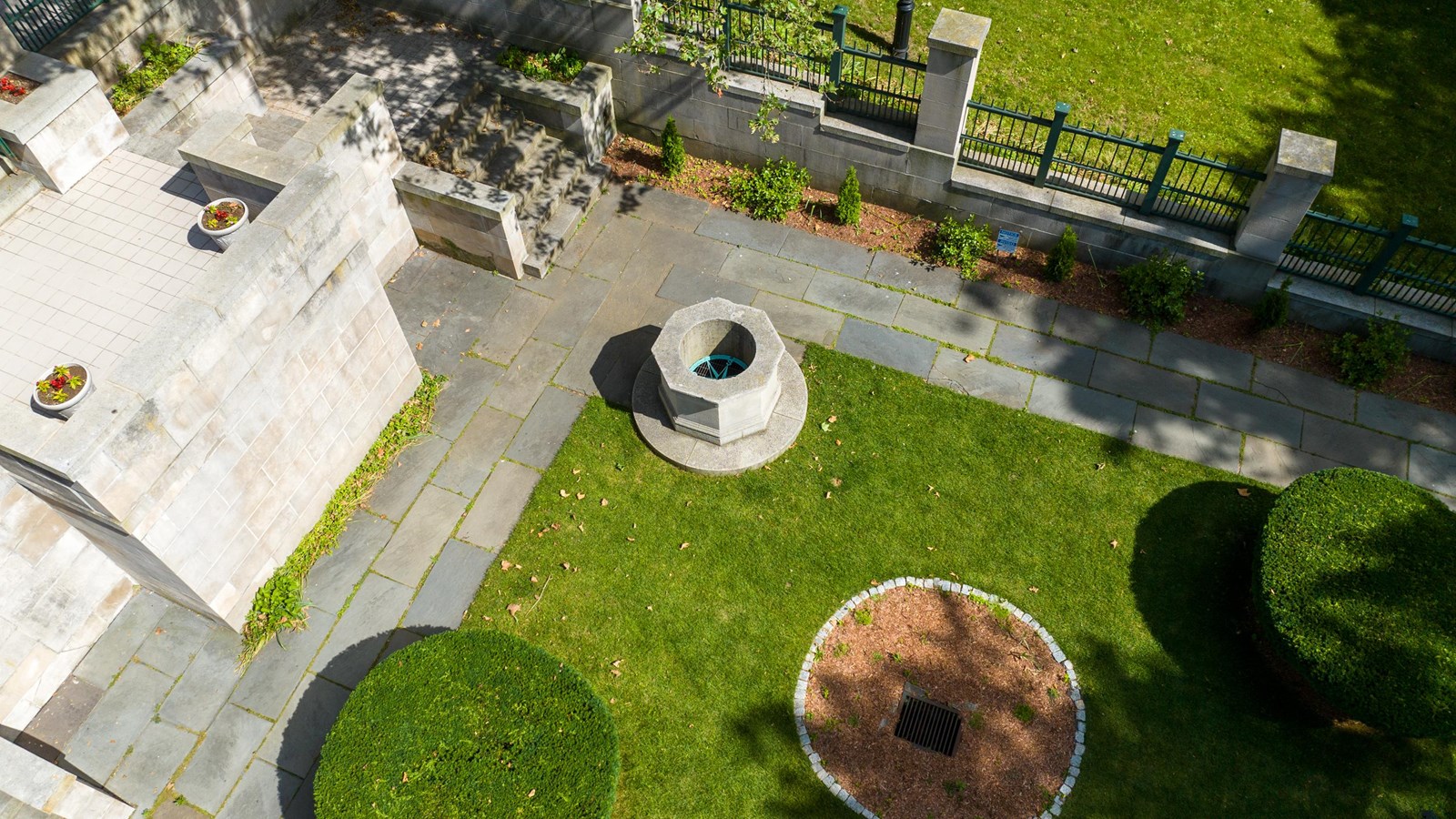 The Hahn memorial is a formal classical garden space with a well and stone walkways