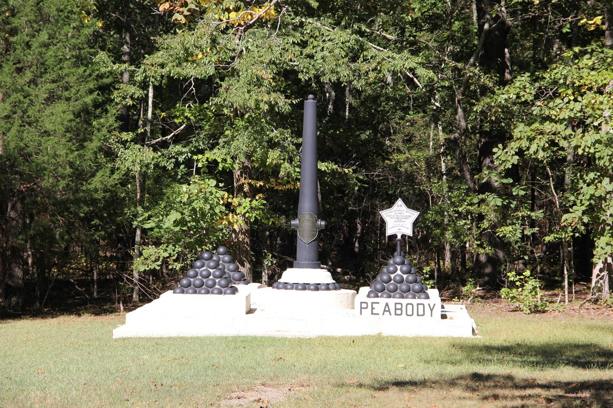 Monument with inverted cannon tube.